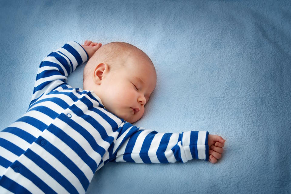 Why Do Babies Sleep With Their Arms Up?