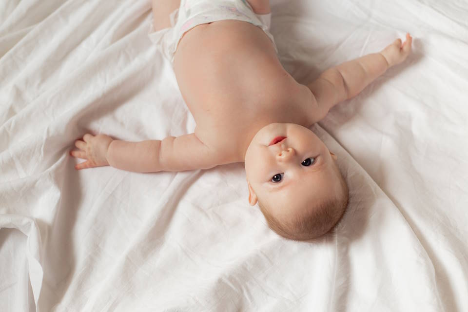 Why Do Babies Sleep With Their Arms Up?
