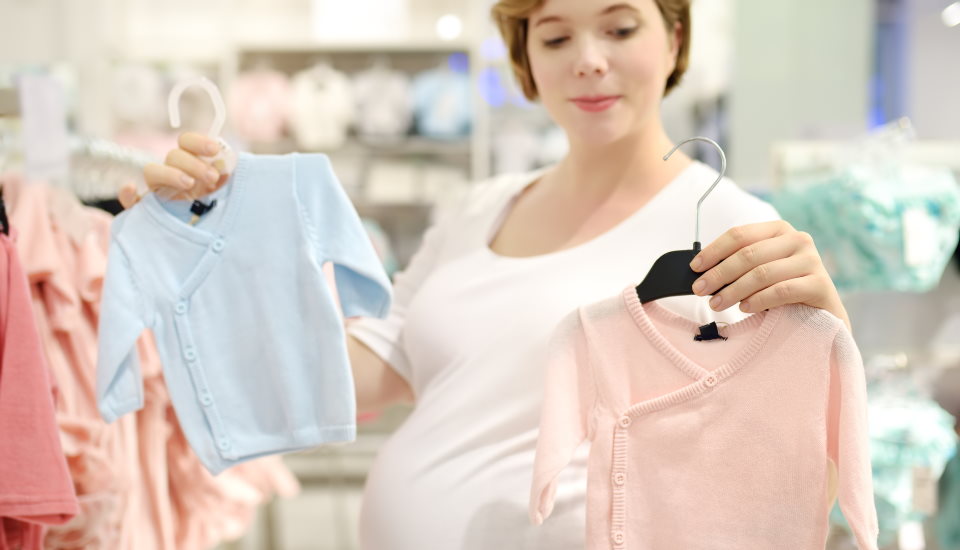 Pregnant Woman Choosing Clothes